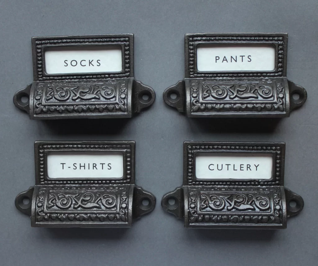 Awesome antique-looking door handles with labels built in. A great addition to any Practical Magic kitchen.